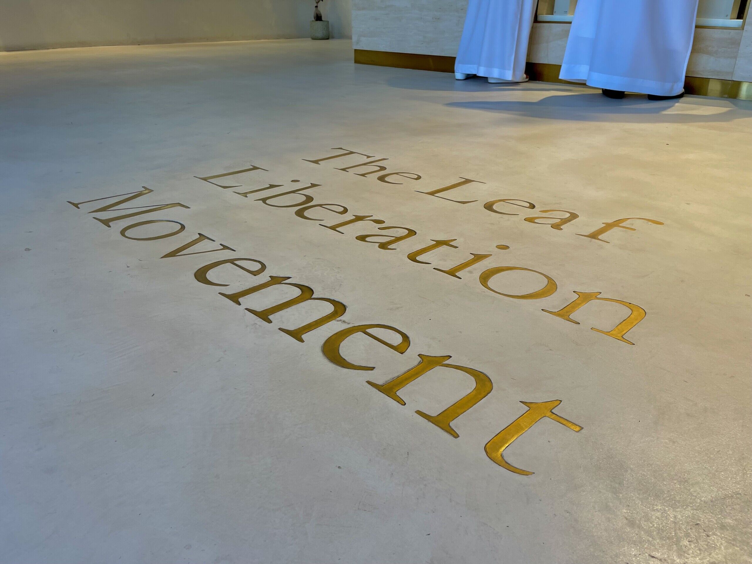 Pekoe Cafe - Microcement Flooring with Engraved Metal Inlays - Reception Area