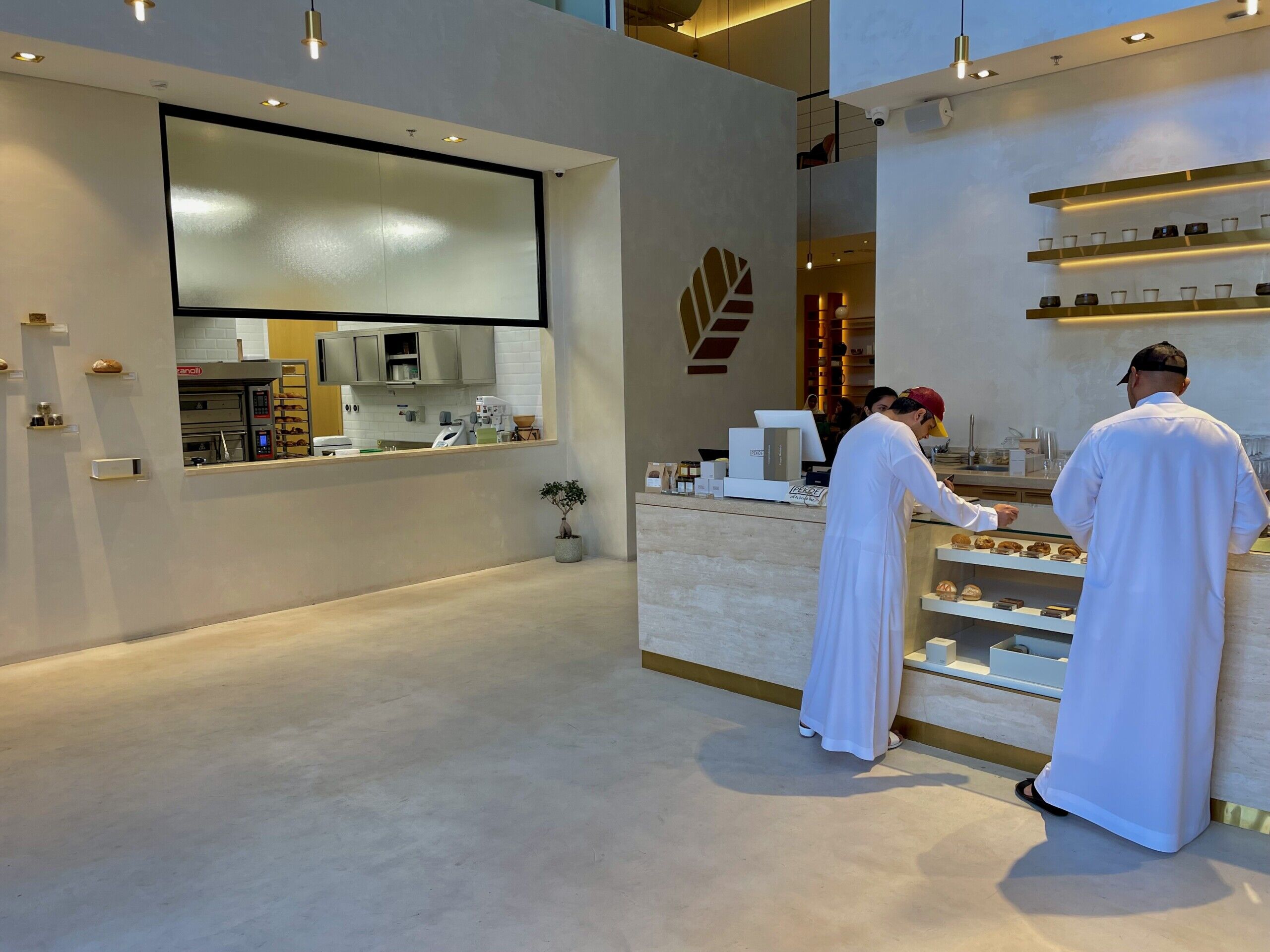 Pekoe Cafe - Microcement Floors and Walls - Reception to Dining Seating Area